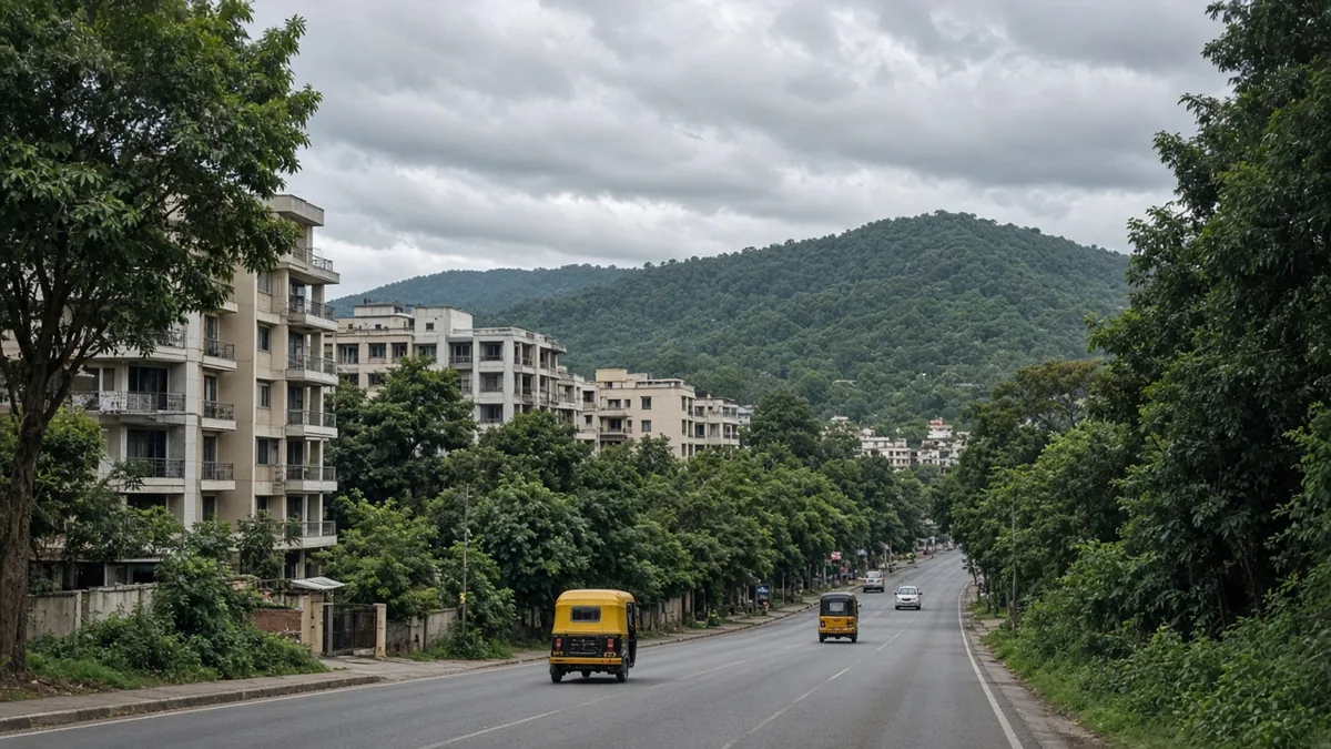 Bannerghatta Road curving past apartments toward green hills